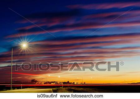 Dramatic evening sky and buildings illuminated by street light, Bonneville, Utah, USA View Large Photo Image Stock Image - Dramatic evening sky and buildings illuminated by street light, Bonneville, Utah, USA. Fotosearch
