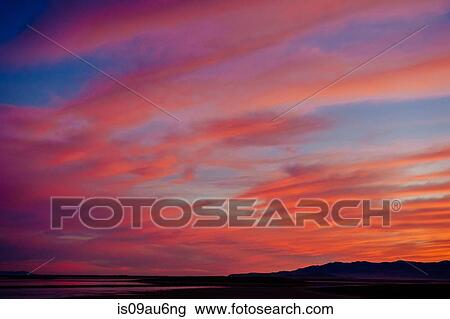 Dramatic orange colour cloudscape in evening sky, Bonneville, Utah, USA View Large Photo Image Stock Image - Dramatic orange colour cloudscape in evening sky, Bonneville, Utah, USA. Fotosearch