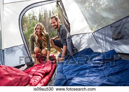 Happy young couple looking into tent, Lake Tahoe, Nevada, USA View Large Photo Image Stock Image - Happy young couple looking into tent, Lake Tahoe, Nevada, USA. Fotosearch