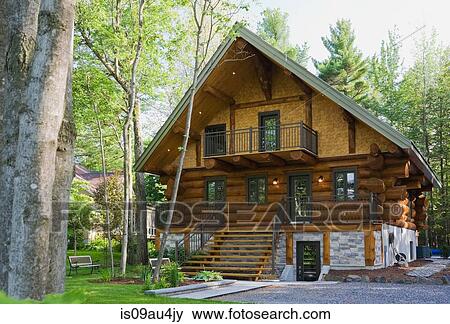 Luxurious Scandinavian cottage style log home facade in late spring, Quebec, Canada View Large Photo Image Stock Photo - Luxurious Scandinavian cottage style log home facade in late spring, Quebec, Canada. Fotosearch