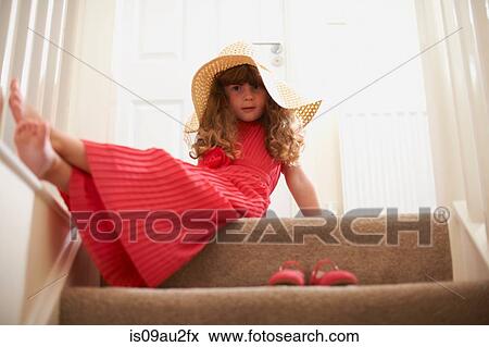 Portrait of girl on stairway wearing straw hat View Large Photo Image Stock Photo - Portrait of girl on stairway wearing straw hat. Fotosearch