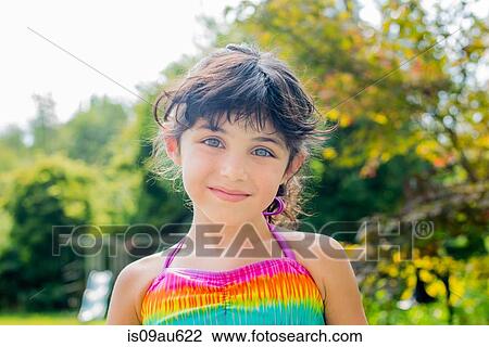 Portrait of girl wearing colourful halter top looking at camera smiling View Large Photo Image Stock Image - Portrait of girl wearing colourful halter top looking at camera smiling. Fotosearch