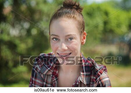 Portrait of teenage girl with dental braces looking at camera smiling View Large Photo Image Stock Image - Portrait of teenage girl with dental braces looking at camera smiling. Fotosearch