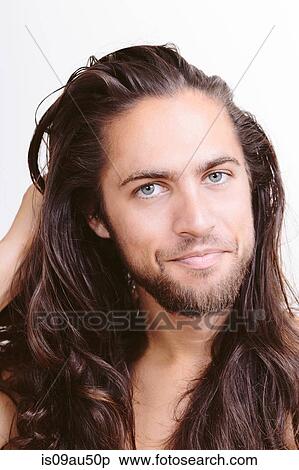 Portrait of young man with long hair, close-up View Large Photo Image Stock Photography - Portrait of young man with long hair, close-up. Fotosearch