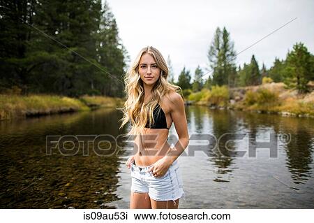 Portrait of young woman in river, Lake Tahoe, Nevada, USA View Large Photo Image Stock Image - Portrait of young woman in river, Lake Tahoe, Nevada, USA. Fotosearch