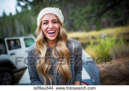 Portrait of young woman wearing knit hat at campsite, Lake Tahoe, Nevada, USA View Large Photo Image Picture - Portrait of young woman wearing knit hat at campsite, Lake Tahoe, Nevada, USA. Fotosearch