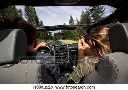 Rear view of young couple on the road in jeep View Large Photo Image Stock Photography - Rear view of young couple on the road in jeep. Fotosearch