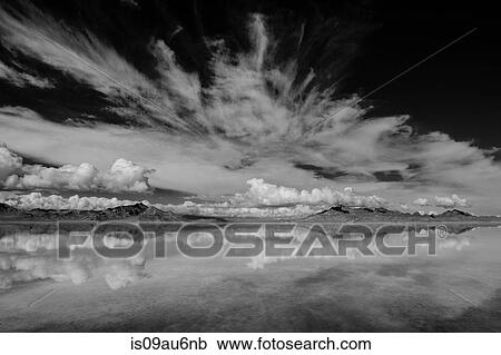 Reflection pool of horizon over water, mountain range and clouds, black and white, Bonneville, Utah, USA View Large Photo Image Stock Image - Reflection pool of horizon over water, mountain range and clouds, black and white, Bonneville, Utah, USA. Fotosearch