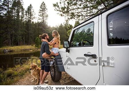 Romantic young couple next to jeep on riverside, Lake Tahoe, Nevada, USA View Large Photo Image Stock Photo - Romantic young couple next to jeep on riverside, Lake Tahoe, Nevada, USA. Fotosearch