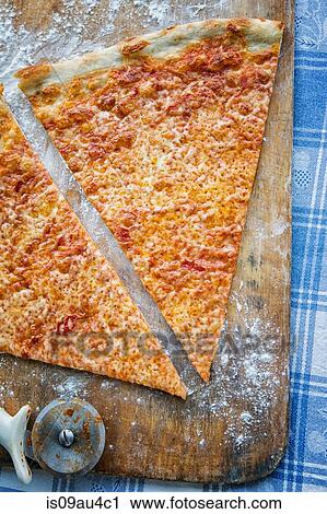 Stock Image - Slice of pizza, overhead view. Fotosearch