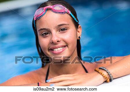 Teenager smiling in swimming pool View Large Photo Image Stock Image - Teenager smiling in swimming pool. Fotosearch