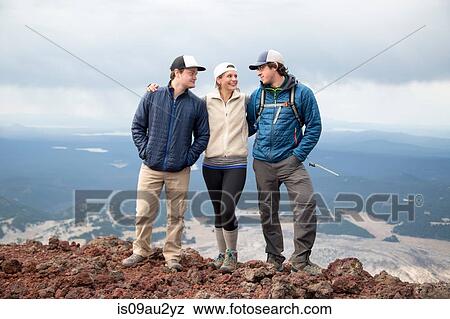 Three friends standing at the summit of South Sister volcano, Bend, Oregon, USA View Large Photo Image Stock Photo - Three friends standing at the summit of South Sister volcano, Bend, Oregon, USA. Fotosearch