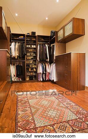 Walk-in closet with carpet in extension in luxurious cottage style log home, Quebec, Canada View Large Photo Image Stock Image - Walk-in closet with carpet in extension in luxurious cottage style log home, Quebec, Canada. Fotosearch