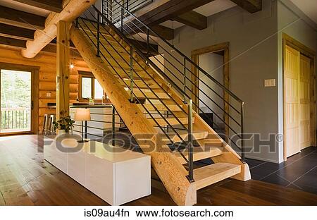 Wood stairway with wrought iron railings in modern Eastern white pine log cabin View Large Photo Image Picture - Wood stairway with wrought iron railings in modern Eastern white pine log cabin. Fotosearch