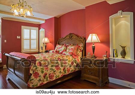 Wooden sleigh bed and night table in master bedroom, cottage style home, Quebec, Canada View Large Photo Image Stock Photograph - Wooden sleigh bed and night table in master bedroom, cottage style home, Quebec, Canada. Fotosearch