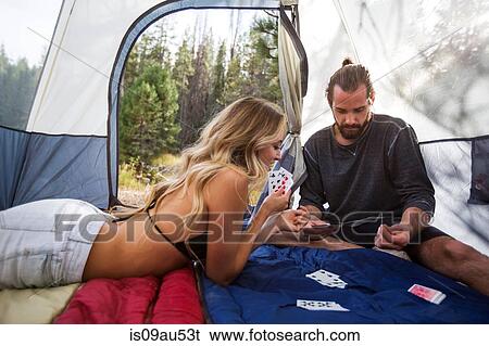 Young couple playing cards in tent, Lake Tahoe, Nevada, USA View Large Photo Image Stock Photograph - Young couple playing cards in tent, Lake Tahoe, Nevada, USA. Fotosearch