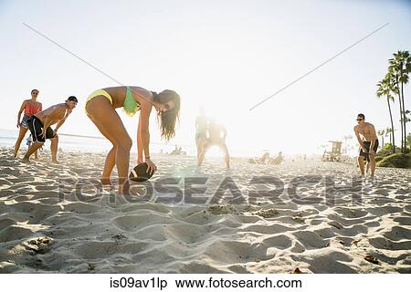 Adult friends playing American football on Newport Beach, California, USA View Large Photo Image Stock Photography - Adult friends playing American football on Newport Beach, California, USA. Fotosearch
