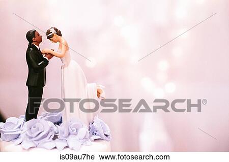 Bride and bridegroom cake decoration on top of wedding cake View Large Photo Image Stock Image - Bride and bridegroom cake decoration on top of wedding cake. Fotosearch