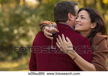 Close up of mature couple hugging in garden View Large Photo Image Stock Photography - Close up of mature couple hugging in garden. Fotosearch