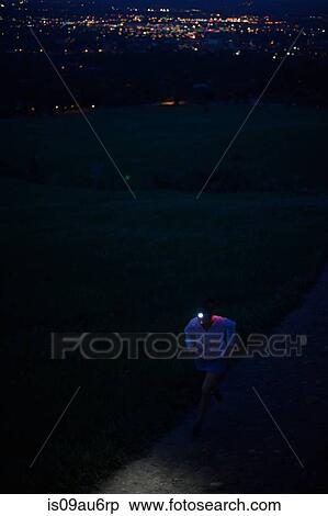 Female trail runner using head torch running up dirt track at night, Colorado Front Range, Boulder, USA View Large Photo Image Stock Photography - Female trail runner using head torch running up dirt track at night, Colorado Front Range, Boulder, USA. Fotosearch