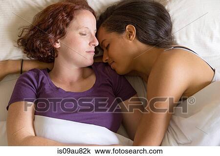 High angle view of lesbian couple lying in bed hugging, sleeping View Large Photo Image Stock Image - High angle view of lesbian couple lying in bed hugging, sleeping. Fotosearch