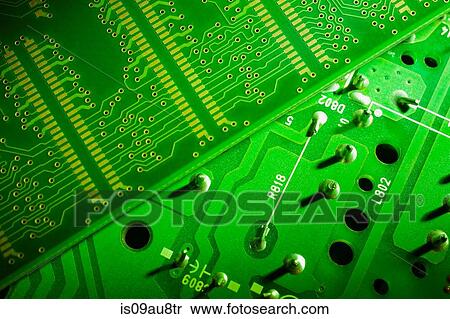 Stock Photography - Overhead close up of green colour circuit board. Fotosearch