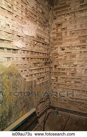 Partially demolished plaster and wooden lattice walls in a room inside an old 1800s cottage style home, Quebec, Canada View Large Photo Image Stock Photograph - Partially demolished plaster and wooden lattice walls in a room inside an old 1800s cottage style home, Quebec, Canada. Fotosearch