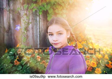 Portrait of girl with plaits in front of orange flowers looking at camera View Large Photo Image Stock Photography - Portrait of girl with plaits in front of orange flowers looking at camera. Fotosearch