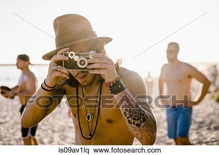 Portrait of young man taking photographs on Newport Beach, California, USA View Large Photo Image Stock Photography - Portrait of young man taking photographs on Newport Beach, California, USA. Fotosearch