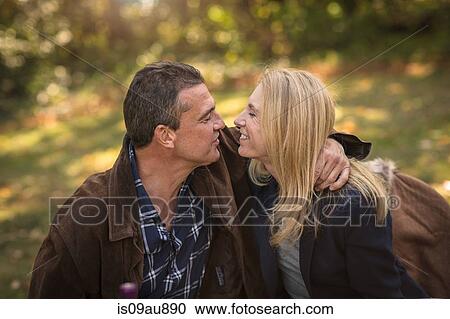 Romantic mature couple in autumn garden View Large Photo Image Stock Image - Romantic mature couple in autumn garden. Fotosearch