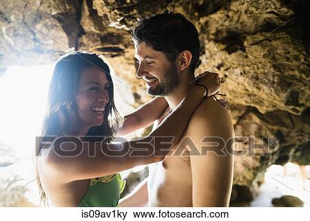 Romantic young couple in cave on Newport Beach, California, USA View Large Photo Image Stock Photo - Romantic young couple in cave on Newport Beach, California, USA. Fotosearch