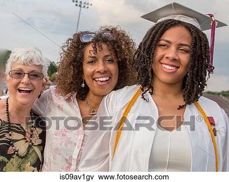 Teenage girl with mother and grandmother at graduation ceremony View Large Photo Image Stock Photo - Teenage girl with mother and grandmother at graduation ceremony. Fotosearch