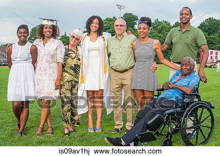 Teenage girl with parents and grandparents at graduation ceremony View Large Photo Image Stock Image - Teenage girl with parents and grandparents at graduation ceremony. Fotosearch