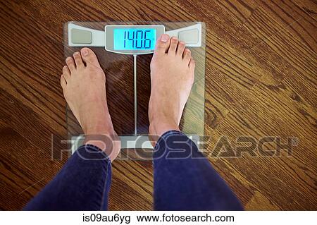 Woman standing scales with digital display, low section, elevated view View Large Photo Image Stock Image - Woman standing scales with digital display, low section, elevated view. Fotosearch