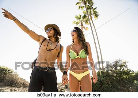Young couple pointing from Newport Beach, California, USA View Large Photo Image Stock Image - Young couple pointing from Newport Beach, California, USA. Fotosearch