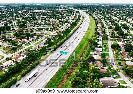 Aerial view of highway through residential area, Miami, Florida, USA View Large Photo Image Stock Photo - Aerial view of highway through residential area, Miami, Florida, USA. Fotosearch