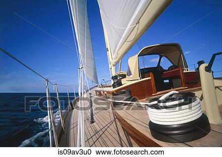 Stock Image - Angled view of sail winch on yacht on ocean. Fotosearch