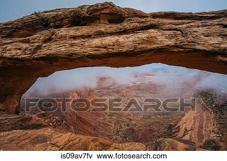 Arch rock formation in fog, Moab, Utah, USA View Large Photo Image Stock Photo - Arch rock formation in fog, Moab, Utah, USA. Fotosearch