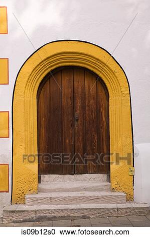 Arched front door and building exterior View Large Photo Image Stock Image - Arched front door and building exterior. Fotosearch