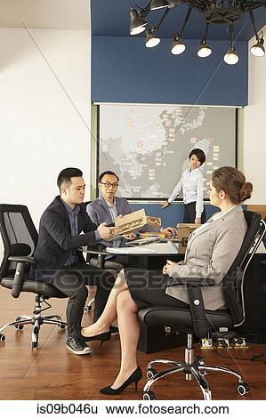 Asian and caucasian management meeting in boardroom of printing and packaging factory, China View Large Photo Image Stock Photograph - Asian and caucasian management meeting in boardroom of printing and packaging factory, China. Fotosearch