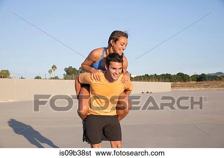 Athletes playing piggyback, Van Nuys, California, USA View Large Photo Image Stock Photograph - Athletes playing piggyback, Van Nuys, California, USA. Fotosearch