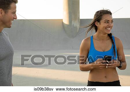 Athletes taking a break, Van Nuys, California, USA View Large Photo Image Stock Photo - Athletes taking a break, Van Nuys, California, USA. Fotosearch