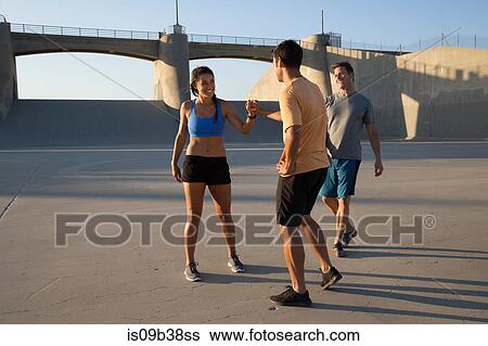 Athletes touching fists, Van Nuys, California, USA View Large Photo Image Stock Photograph - Athletes touching fists, Van Nuys, California, USA. Fotosearch