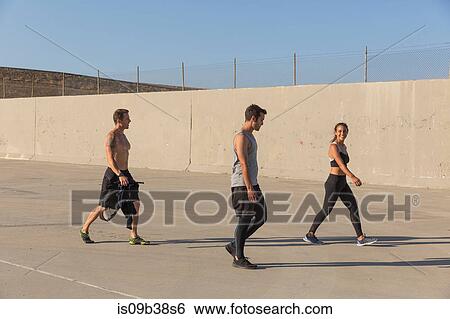 Athletes walking before workout, Van Nuys, California, USA View Large Photo Image Stock Photograph - Athletes walking before workout, Van Nuys, California, USA. Fotosearch