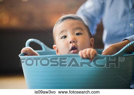 Baby boy sitting inside tub View Large Photo Image Picture - Baby boy sitting inside tub. Fotosearch