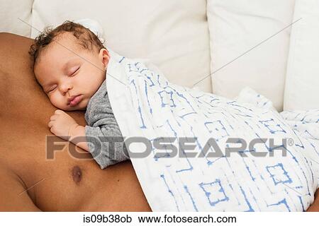 Baby sleeping on father's chest View Large Photo Image Stock Image - Baby sleeping on father's chest. Fotosearch