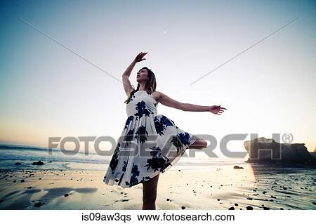 Stock Photograph - Ballerina dancing on beach. Fotosearch