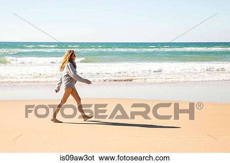 Bare legged woman wearing hoody striding out on beach, Conil de la Frontera, Spain View Large Photo Image Stock Photograph - Bare legged woman wearing hoody striding out on beach, Conil de la Frontera, Spain. Fotosearch
