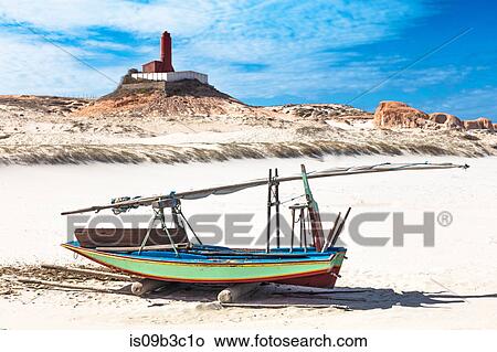 Beached fishing boat and lighthouse, Fortim, Ceara, Brazil View Large Photo Image Picture - Beached fishing boat and lighthouse, Fortim, Ceara, Brazil. Fotosearch