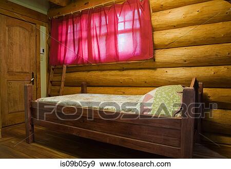 Bedroom of a 2003 built cottage style log home, Townships, Quebec, Canada View Large Photo Image Stock Photo - Bedroom of a 2003 built cottage style log home, Townships, Quebec, Canada. Fotosearch